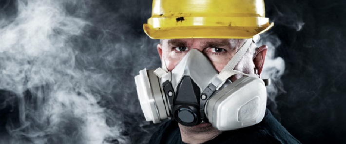 A Mining Engineer Wearing Safety Helmet and Mask in Underground Mining Sector.