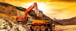 Amazing view at yellow excavator with a shovel at a construction site in a beautiful twilight