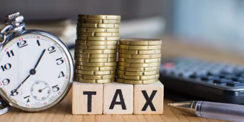 Image That Denotes Tax Saving Deduction Concept With Clock and Coins.