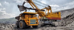 Yellow Mining Truck Extracting Minerals From The Surface.