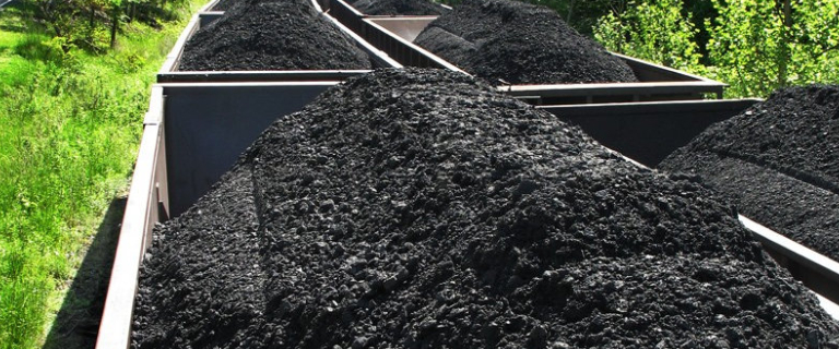 An Image Of Black Coal Transmitting Via Train.