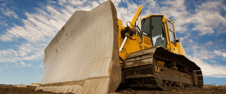 Mining Truck Holding A Big Mineral Stone From the Surface.